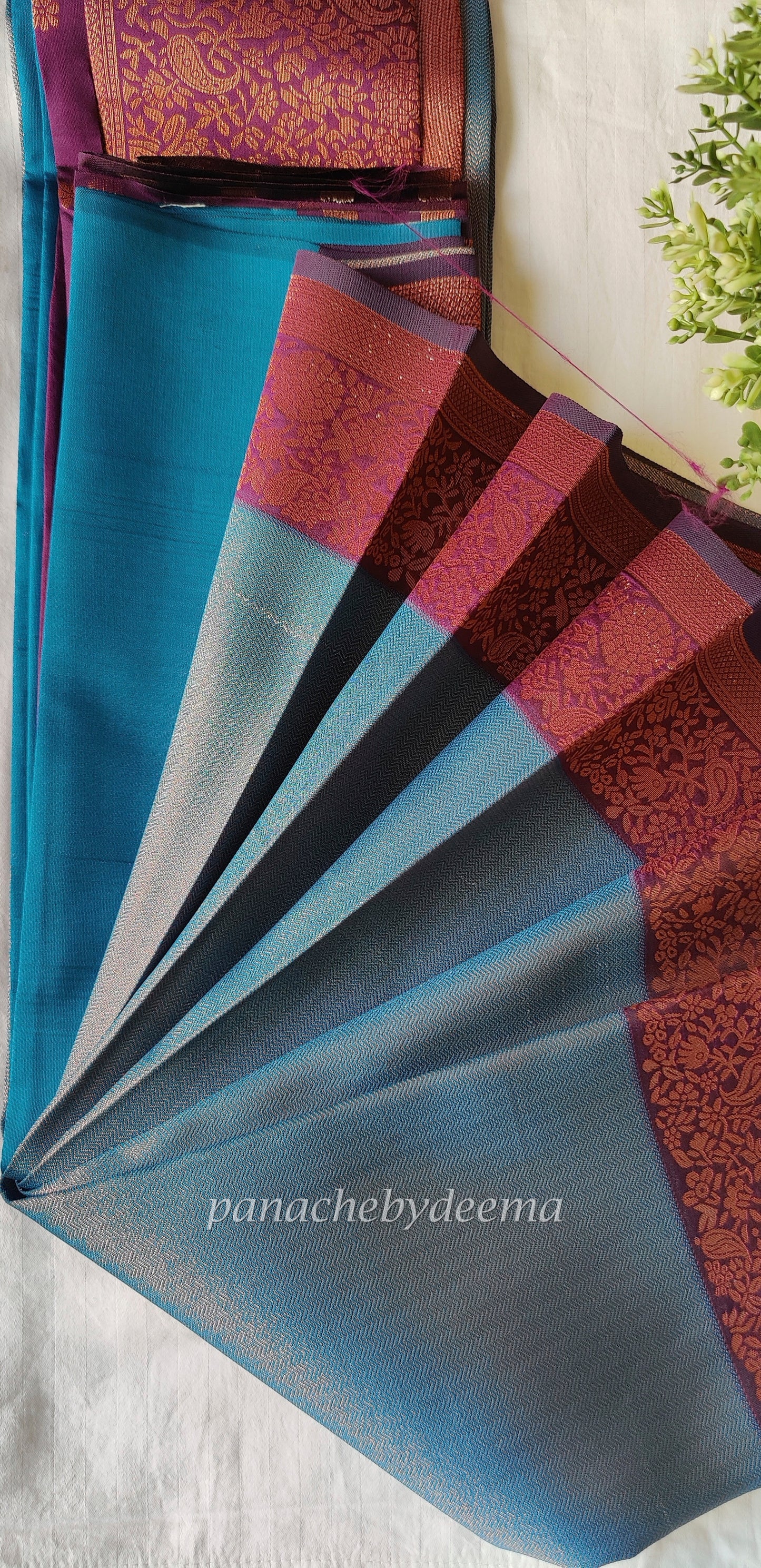 Peacock blue with maroon border
